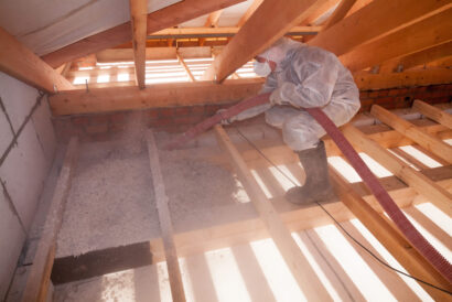 Worker,With,A,Hose,Is,Spraying,Ecowool,Insulation,In,The Worker,With,A,Hose,Is,Spraying,Ecowool,Insulation,In,The